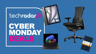 A ThinkPad, iPad, Moleskine notebook, and Herman Miller Embody office chair on a blue background next to a TechRadar badge reading 'Cyber Monday deals'