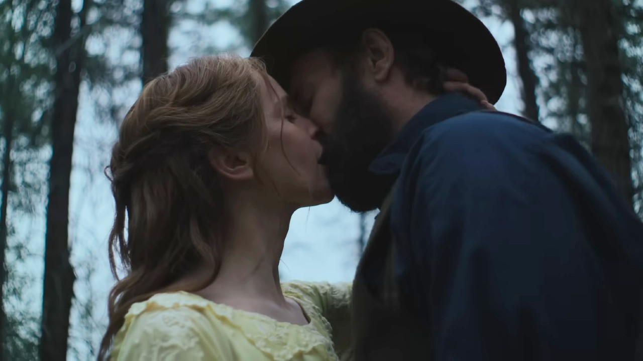 Felicity Jones and Joel Edgerton kissing in Train Dreams.