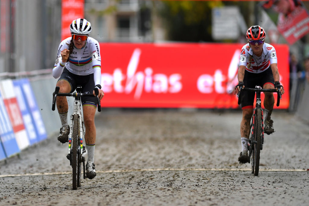 OVERIJSE BELGIUM OCTOBER 31 LR Lucinda Brand of The Netherlands and Team Baloise Trek Lions and Denise Betsema of The Netherlands and Team Pauwels Sauzen Bingoal cross the finishing line during the 62nd Druivencross Overijse UCI CycloCross Worldcup 2021 Womens Elite DruivencrossOverijse CXWorldCup UCIcyclocrossWC on October 31 2021 in Overijse Belgium Photo by Luc ClaessenGetty Images