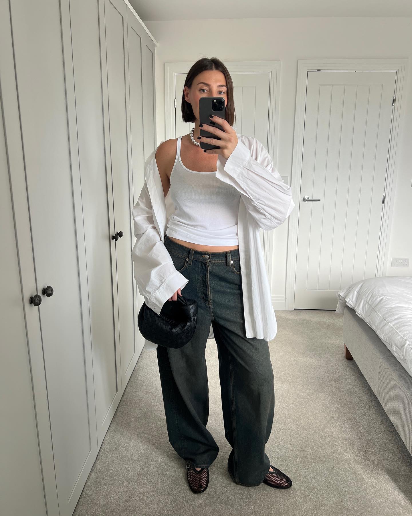 White shirt outfits: @sarahlouiseblythe wears a white shirt and baggy jeans