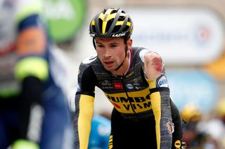 Primoz Roglic crosses the line bashed up on stage 3 of the Tour de France
