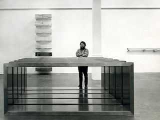 Donald Judd with his work