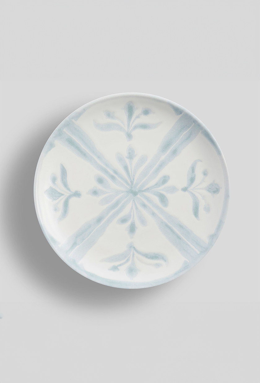 Tile and stone baby blue and white designed dinner plate from Pottery Barn
