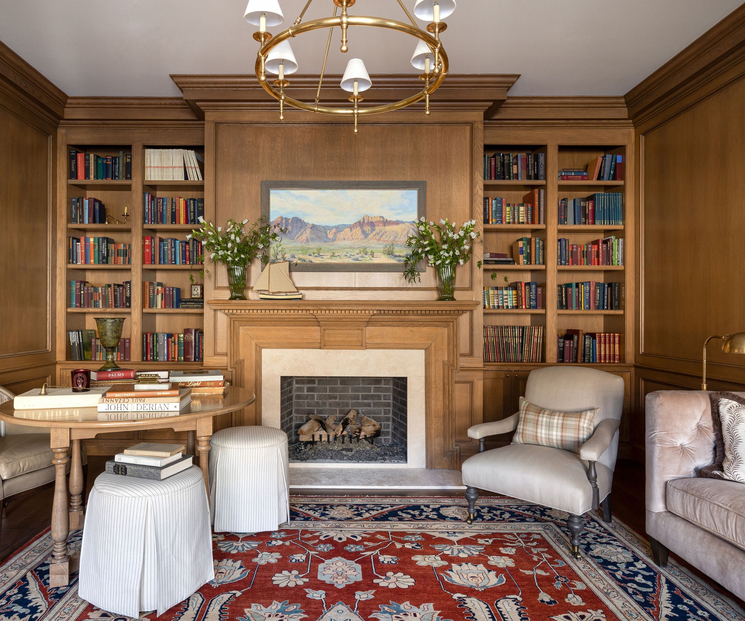library den with wood paneling and alcove shelves