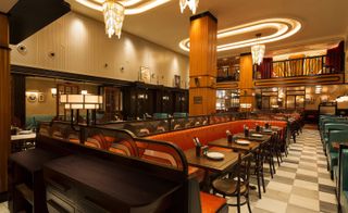 Restaurant with ceiling lamps and tables with chairs