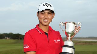 Min Woo Lee with the ISPS Handa Vic Open trophy