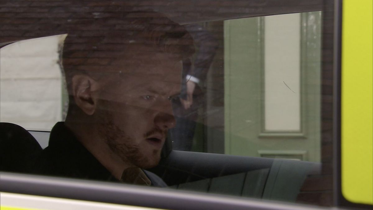 Coronation Street Gary Windass in a poilice car