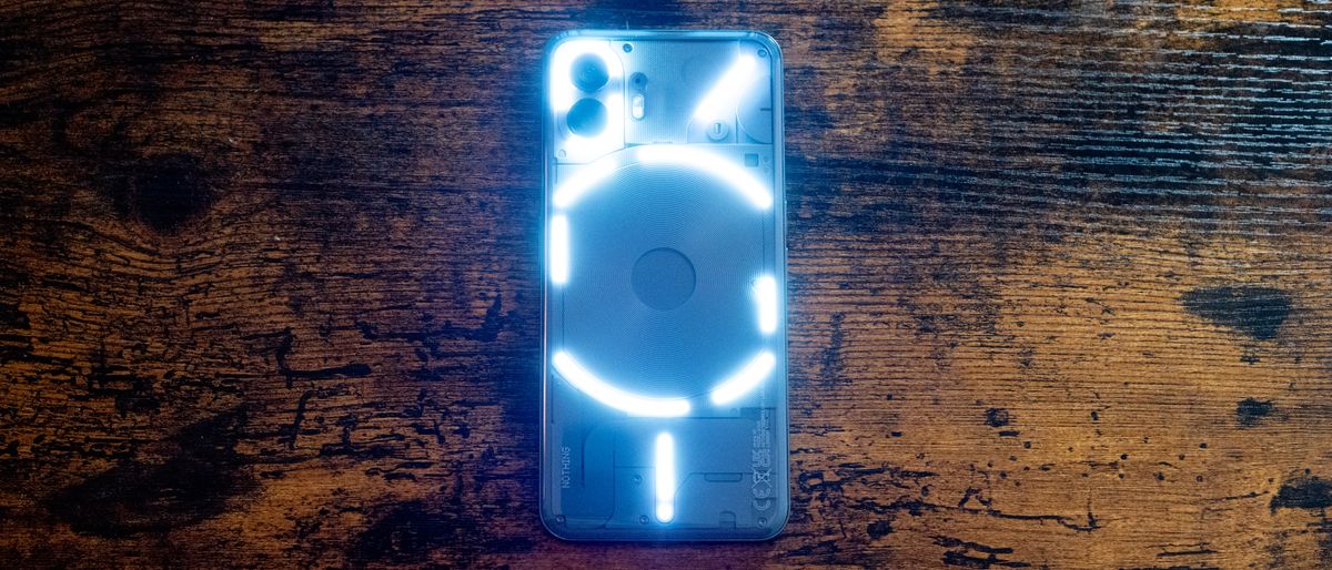 Nothing Phone 2 showing screen and lit glyph LED lights