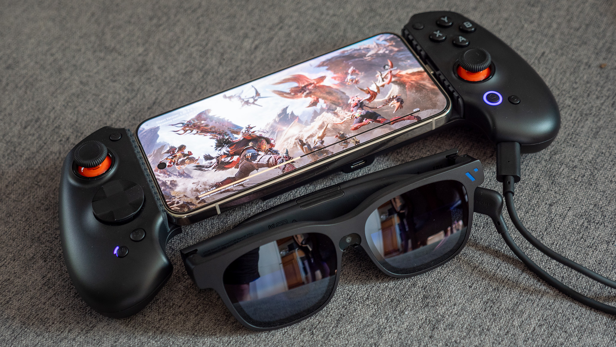 The Witcher Beast smart glasses connected to the Absolut S9V controller while playing Monster Hunter Outlanders on a Google Pixel 10 Pro XL.
