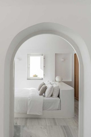 Double bed shot through guestroom archway