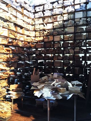 Room with shelving units full of papers