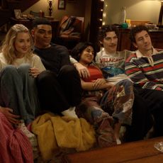 A group of friends (l-r Lucy Freyer as Billie, Owen Thiele as Anton, Amita Rao as Issa, Jack Innanen as Paul Baker, Malik Elassal as Samir) cuddle together on a living room couch, in the FX series 'Adults.'