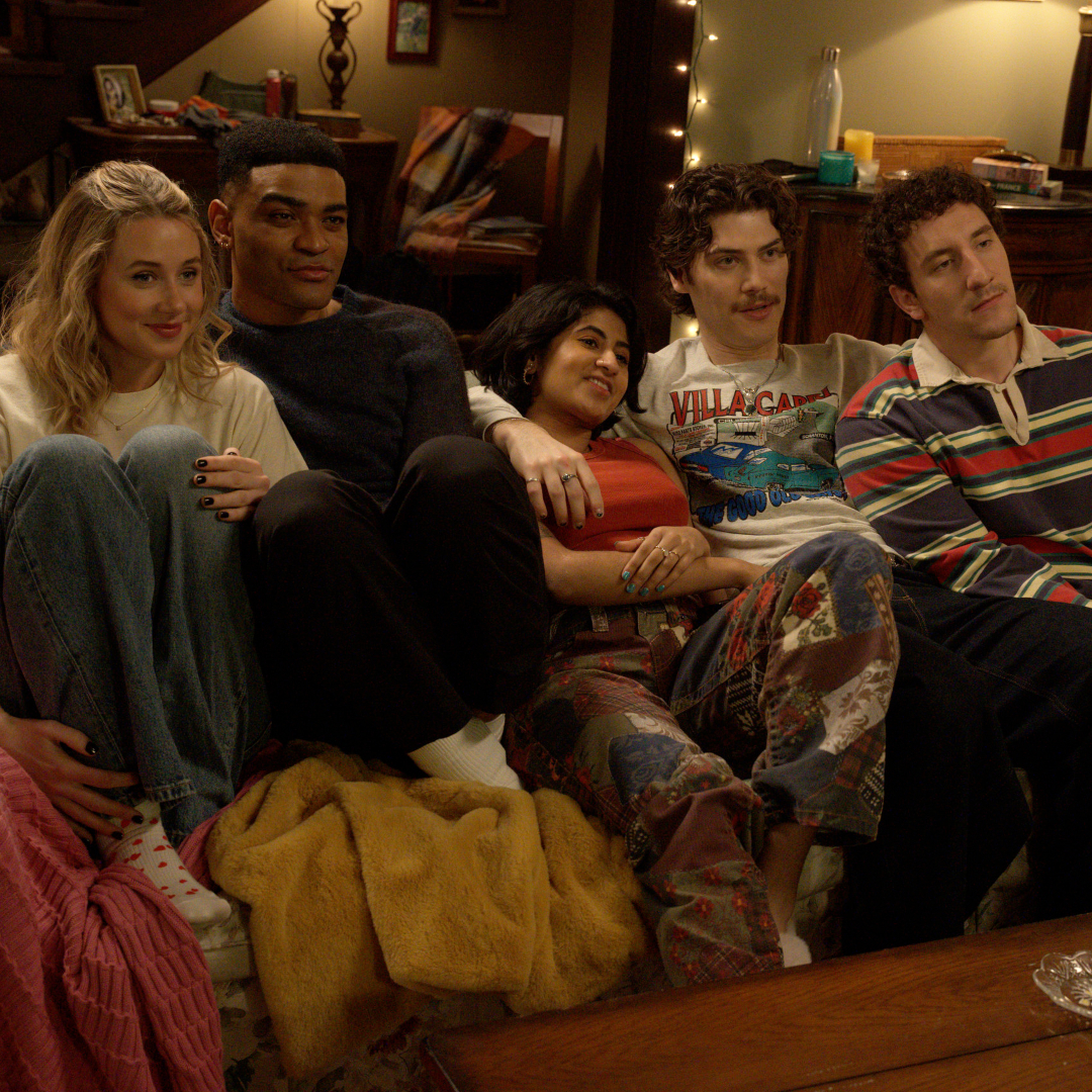A group of friends (l-r Lucy Freyer as Billie, Owen Thiele as Anton, Amita Rao as Issa, Jack Innanen as Paul Baker, Malik Elassal as Samir) cuddle together on a living room couch, in the FX series 'Adults.'