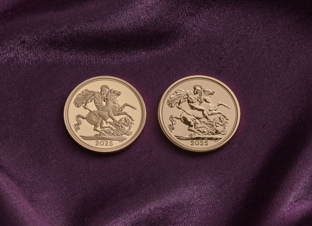 Two gold 2025 sovereign coins on a purple velvet backdrop