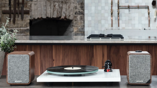 Ruark Audio MR1 Mk2 speakers flanking a Rega turntable in a home setting