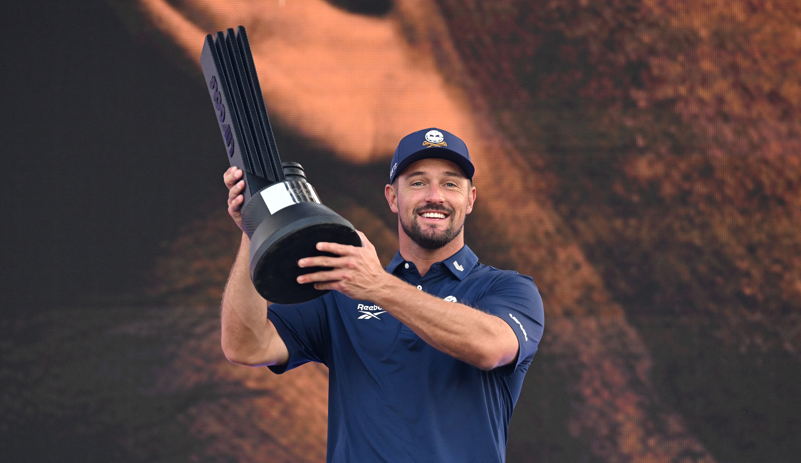 Bryson DeChambeau holds the LIV Golf Korea trophy