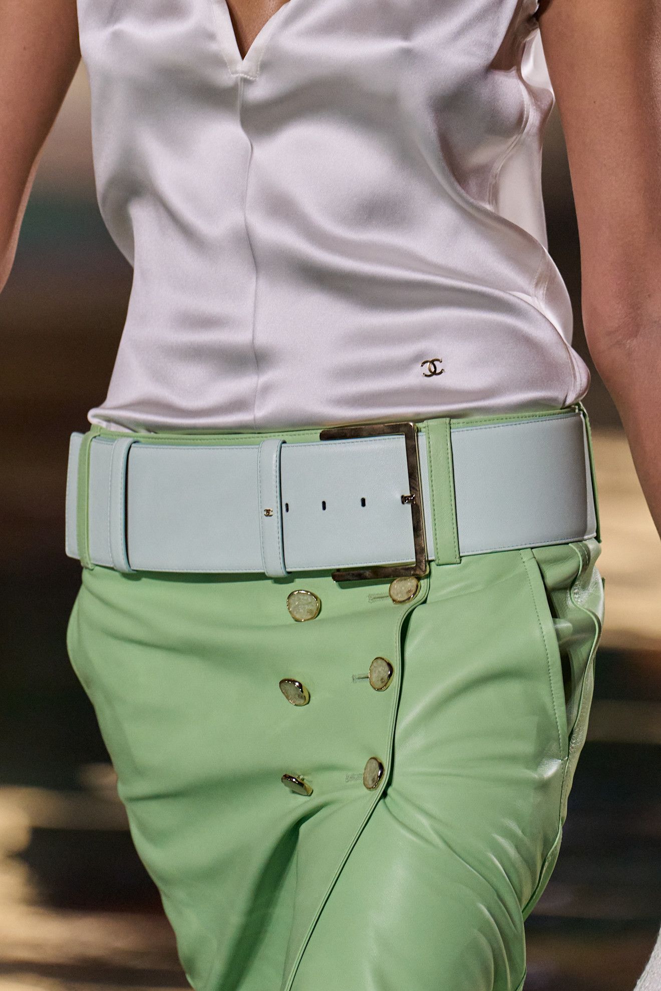 A model wore a statement belt on the Chanel Spring 2027 runway