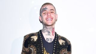 a portrait of lil peep smiling at the camera