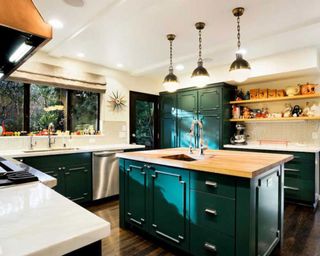 kitchen with wooden flooring black cabinet and wooden countertop