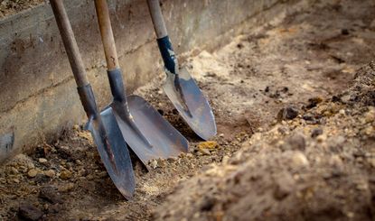 Three Shovels In A Drainage Ditch