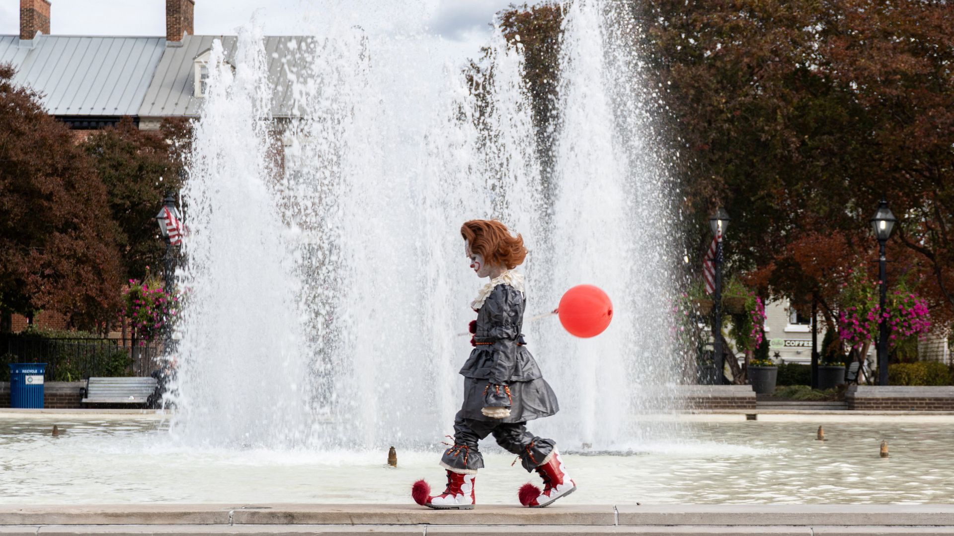 
                                A child dressed as Pennywise the clown from Stephen King’s “It” walks near a fountain in Alexandria, Virginia
                            