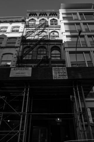 Black and white image of the exterior of Christo's studio, outside 48 Howard Street, NYC