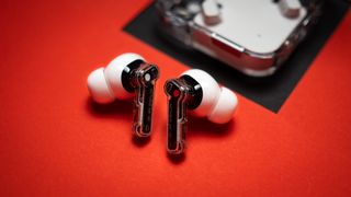 Nothing Ear (2) earbuds review on red background