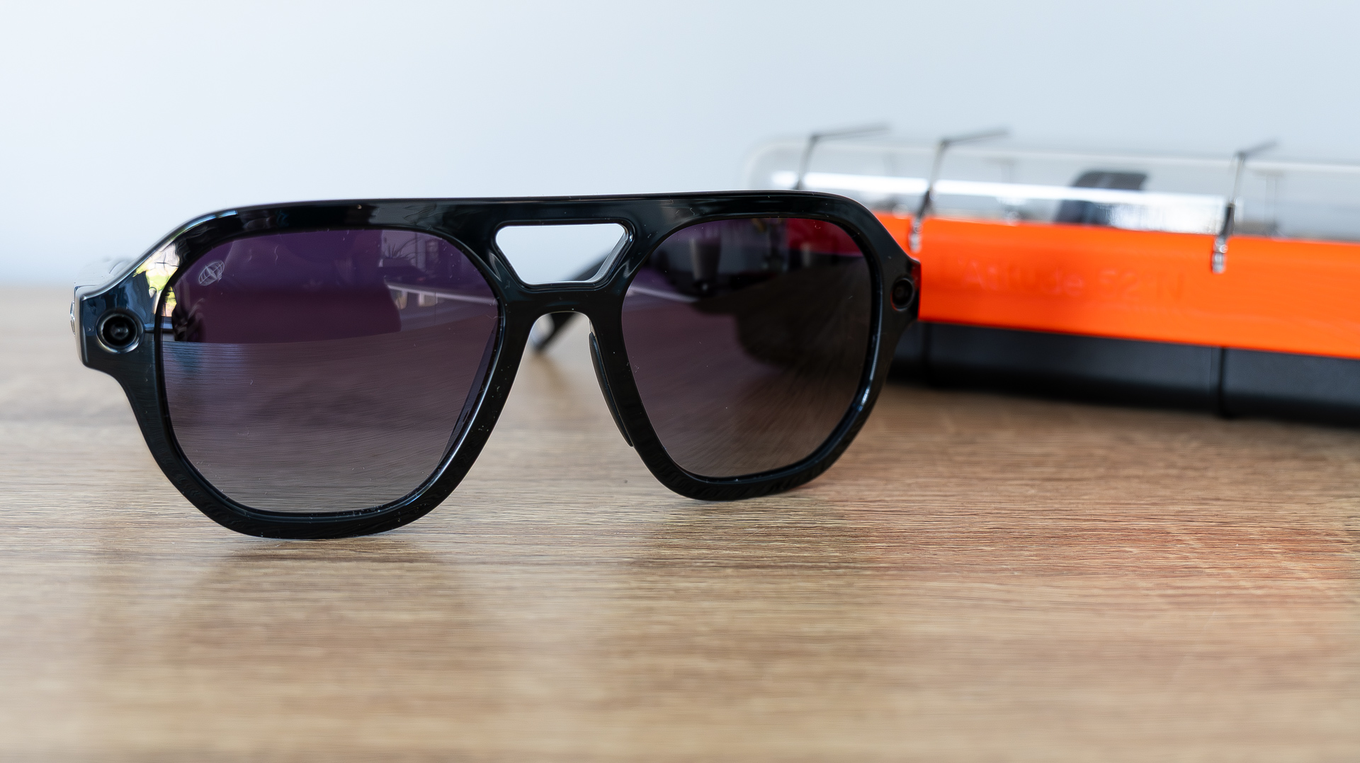 L'Atitude 52&deg;N Smart Glasses review images, in case, on a sideboard and worn outside