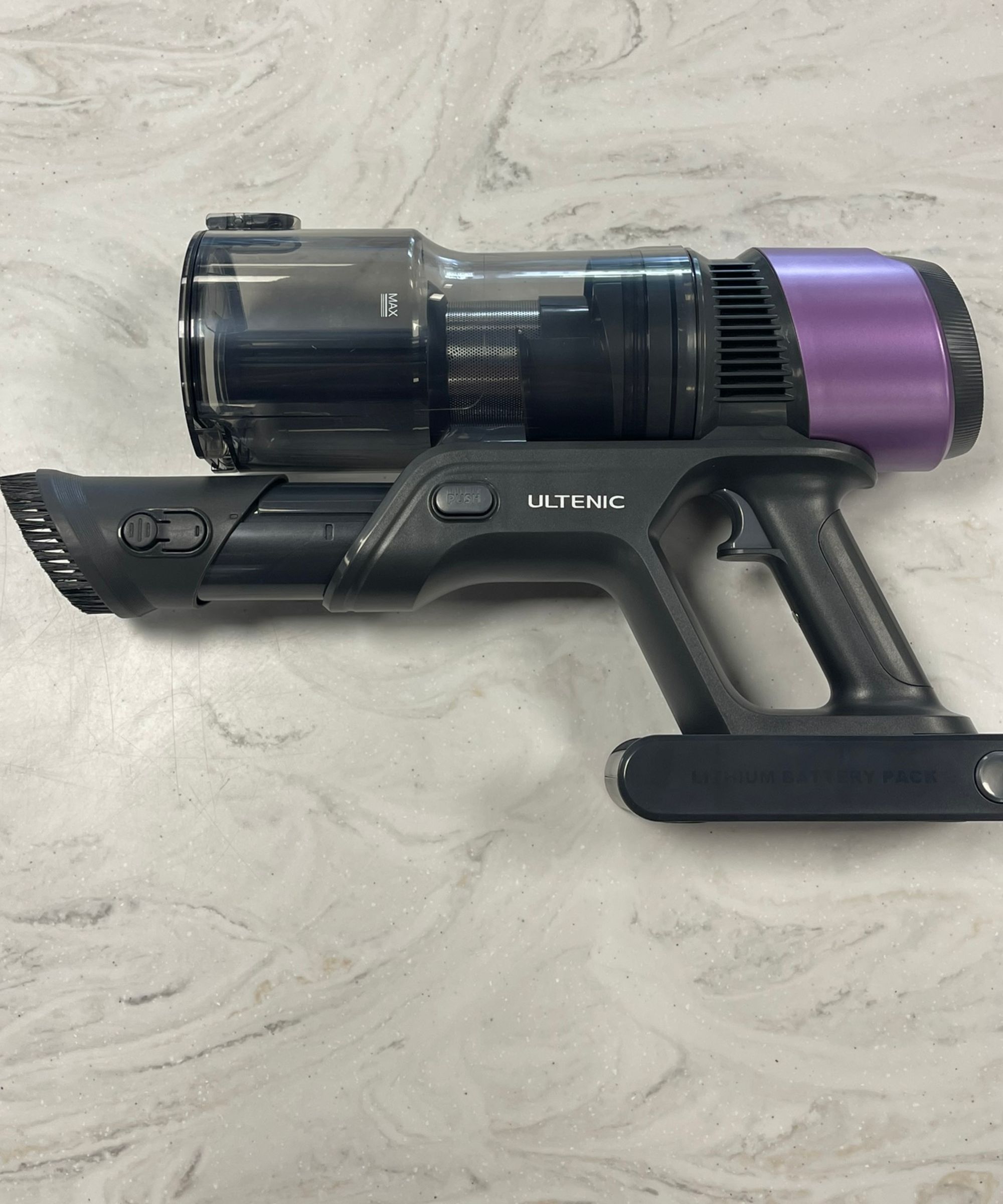 Ultenic U20 cordless vacuum without attachments on marble countertop in Future test center.