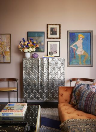 A colorful NYC apartment with wall art of all shapes and sizes
