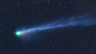 A bright green comet with a long tail