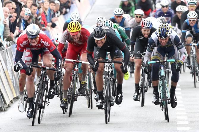 Tour of Belgium leader Andre Greipel (Lotto Belisol), left, powers to the finish line in Ninove where he would win his second straight stage.