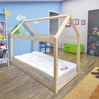 kids bedroom with blue cartoons wall and wooden bed