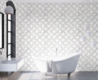 White bathroom wallpaper with geometric print, freestanding bath, basin, black painted window frames and dark flooring