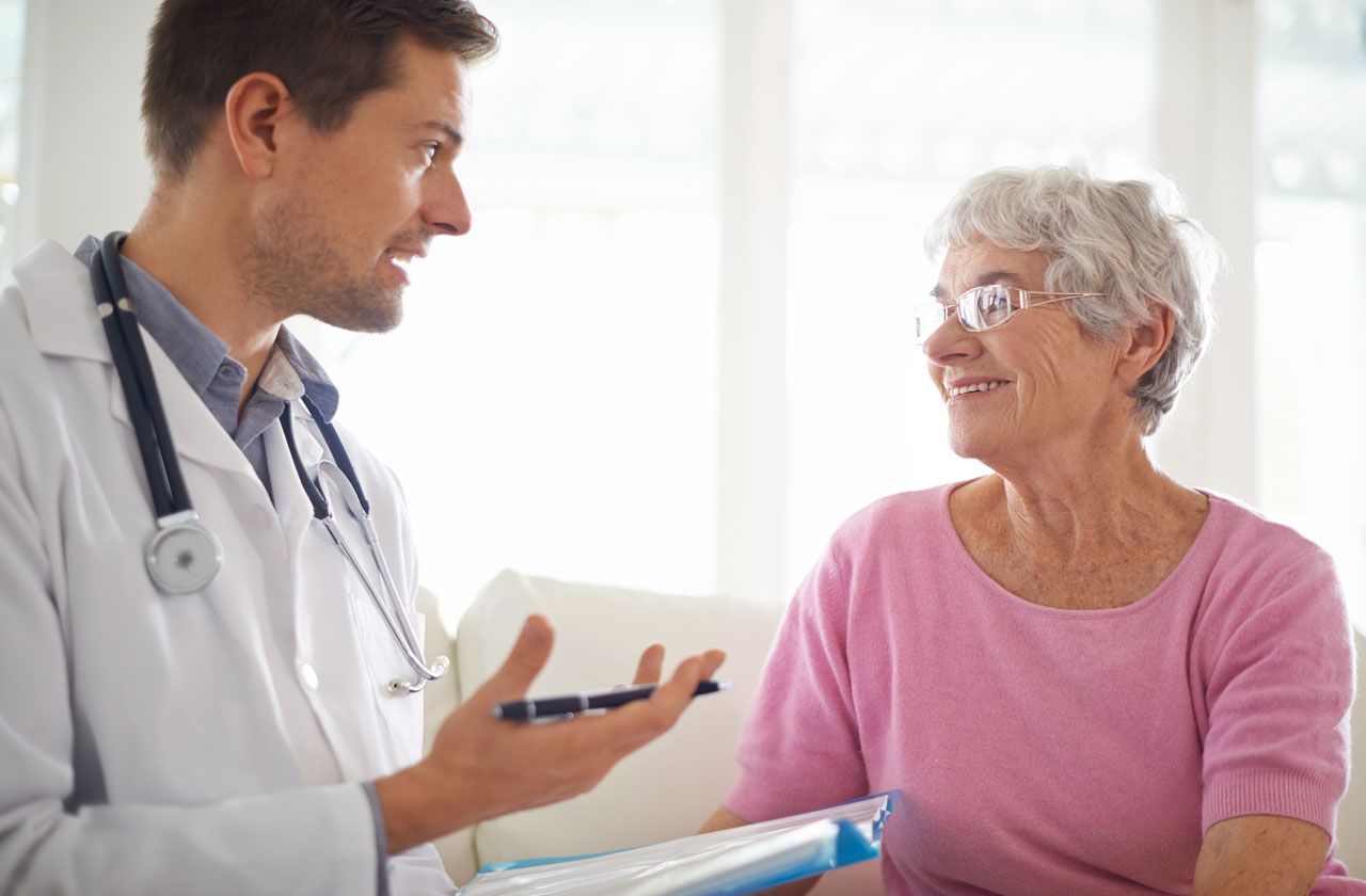 Shot of a male doctor explaining something to his senior patient