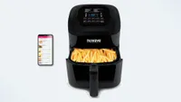 NuWave Brio 6 Quart Digital Air Fryer with fries inside the basket, and phone app beside it