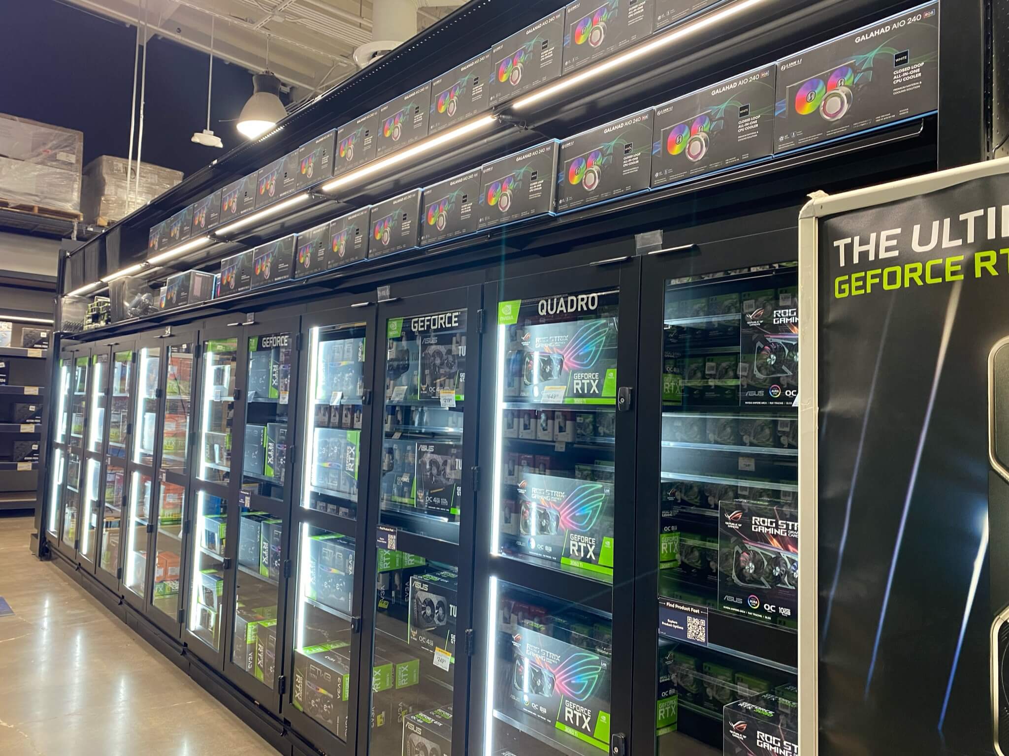 A photo of an aisle inside a microcenter store showing graphics cards