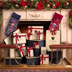 Aspinal of London gifts by a festive fireplace