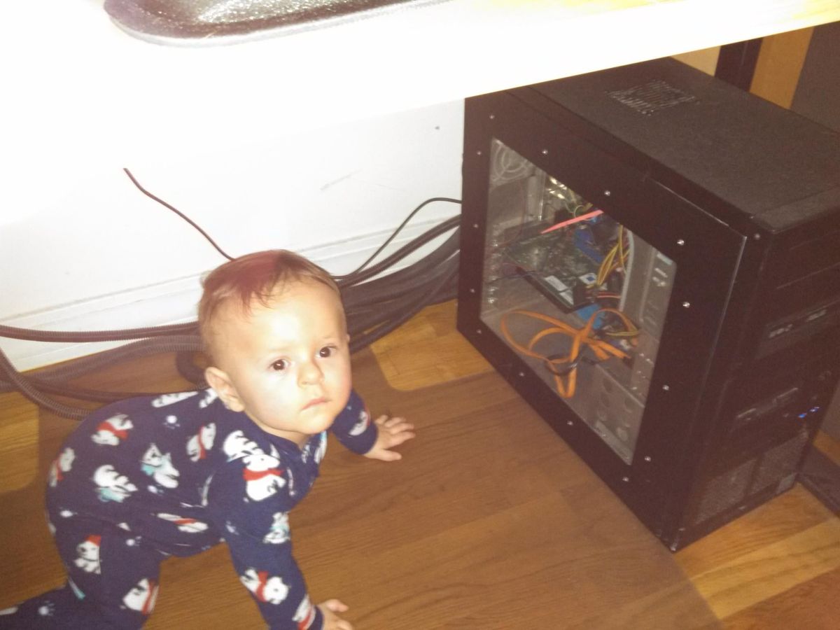 Isaac Checking Out a Desktop at a Few Months Old
