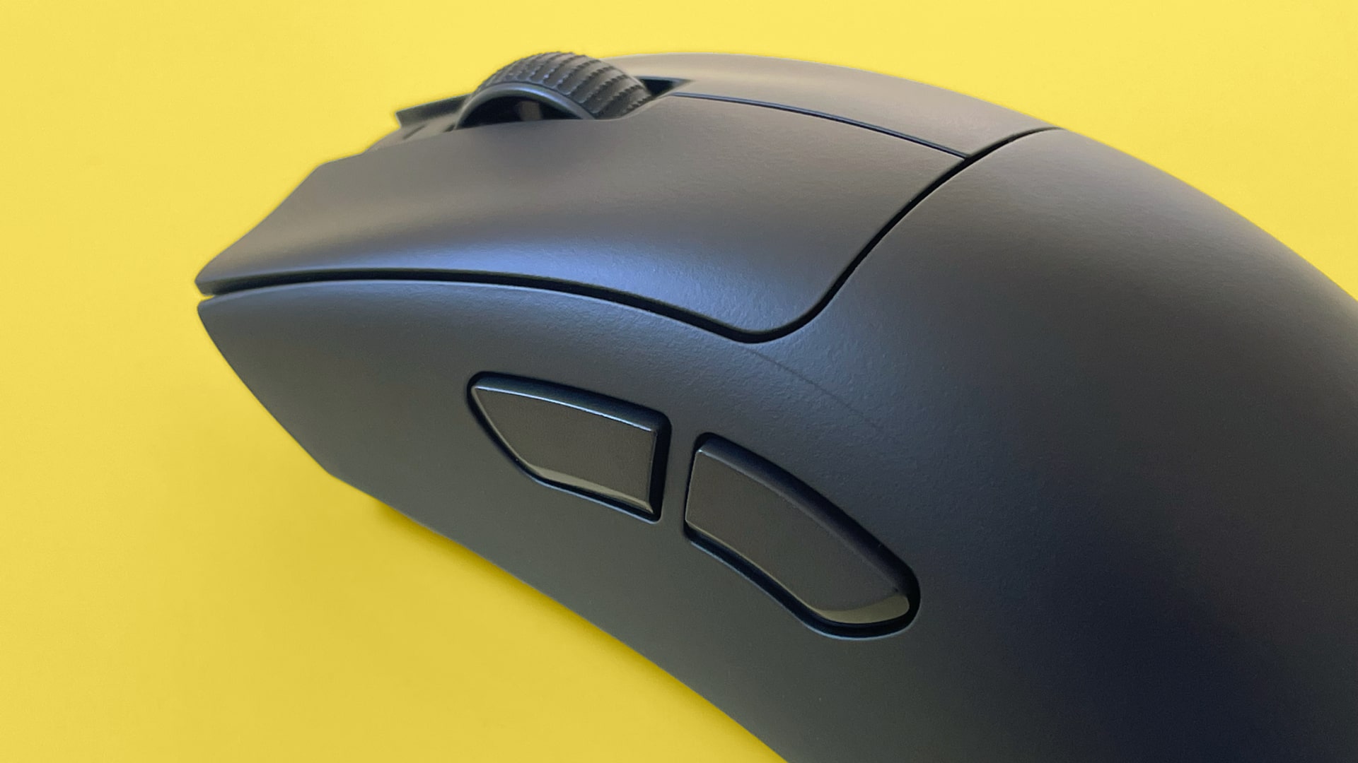 A Razer DeathAdder V3 HyperSpeed mouse against a yellow background.