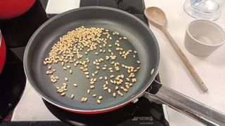 Toasting pine nuts on a SMEG induction cooktop