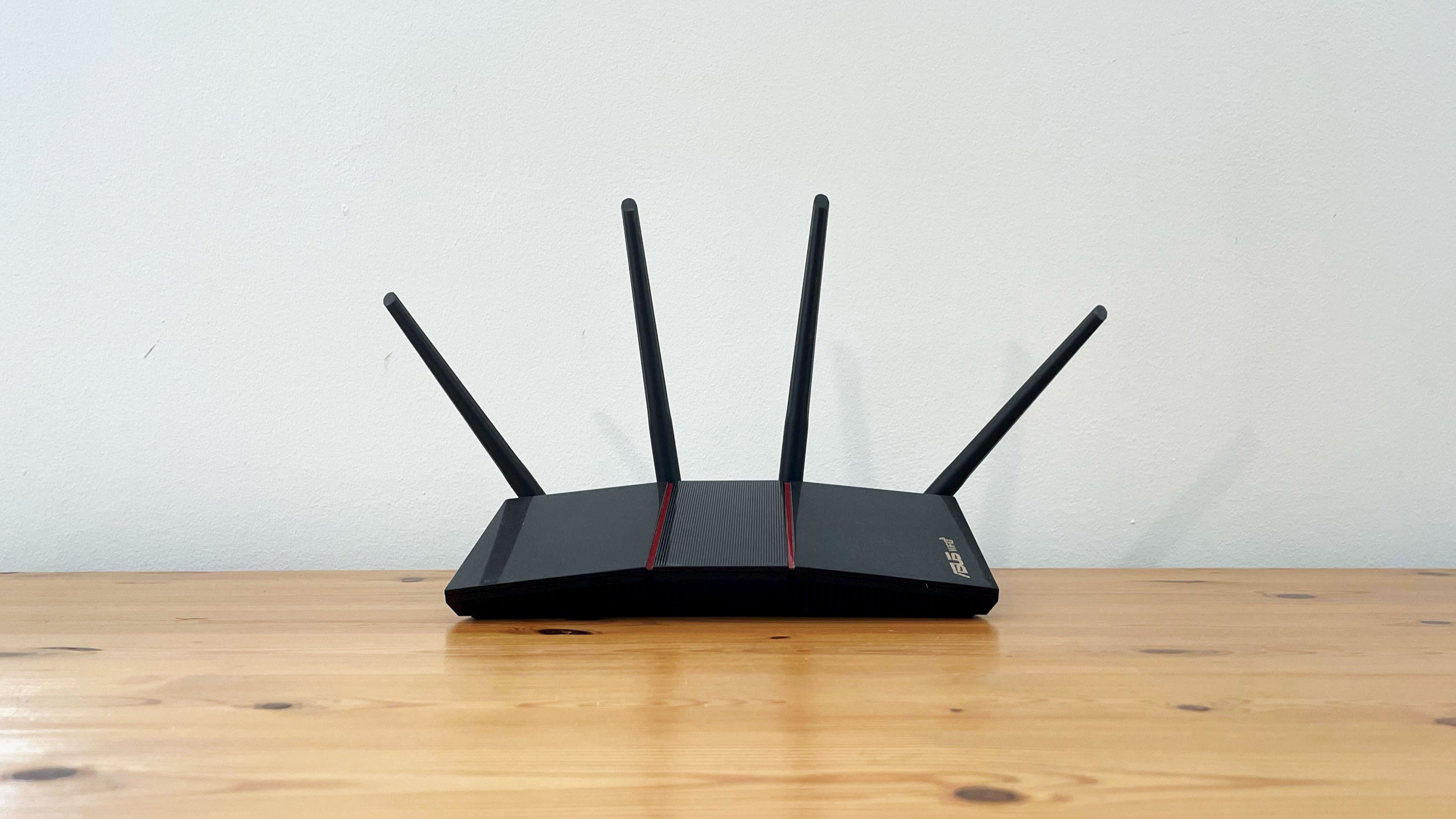 best Asus router Asus RT-AX55 on a wood desk