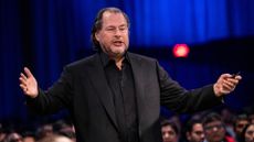 Marc Benioff, CEO at Salesforce, stood with his arms out speaking in front of conference attendees at the 2024 Dreamforce conference in San Francisco, California.