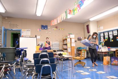 Teachers Nancy Rastetter and Marisa Wiezel, who is related to the photographer, prepare for the 2020/2021 school year in Wiezel's classroom at Yung Wing School P.S. 124 on August 25, 2020 in 