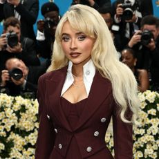 Sabrina carpenter wears a blazer and no pants to the met gala.