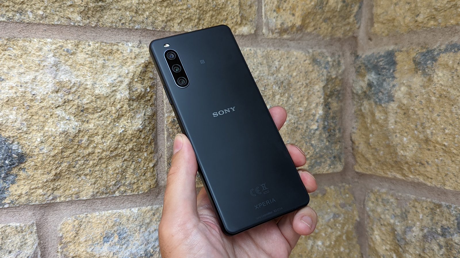 The Sony Xperia 10 IV (back), held in a hand
