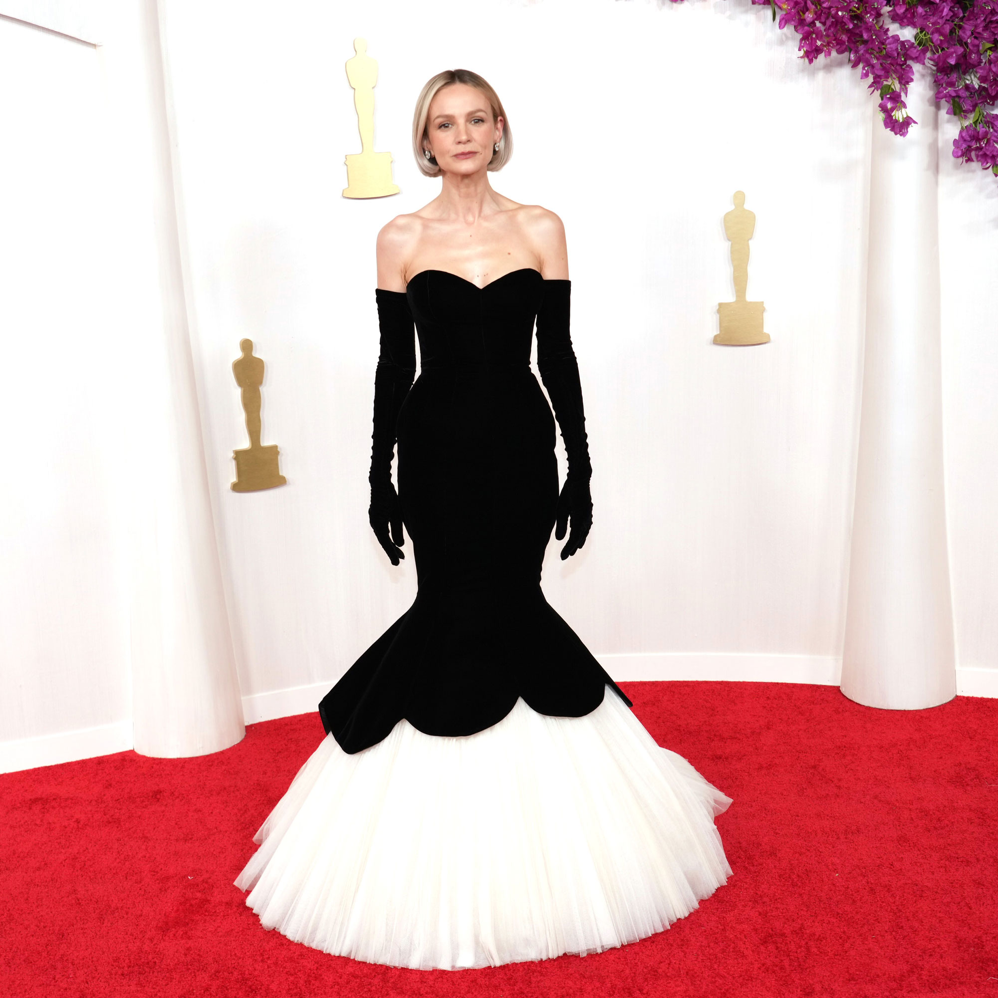 Carey Mulligan wears a strapless mermaid dress by Balenciaga on the 2024 Oscars red carpet