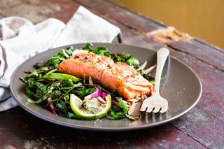 Salmon and leafy greens on a plate