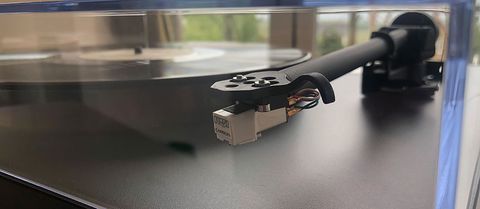 Close up of Rega Planar PL1 arm and turntable