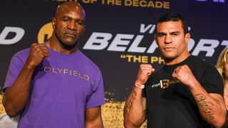 Evander Holyfield and Vitor Belfort pose during a press conference ahead of heavyweight fight